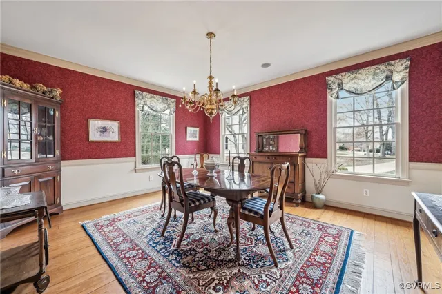 a spacious bathroom with a granite countertop sink mirror and a bathtub