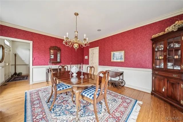 a kitchen with stainless steel appliances granite countertop a sink and dishwasher a stove top oven with white cabinets