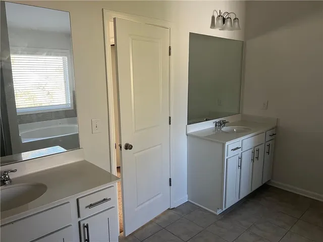 a view of a hallway with wooden floor and stairs