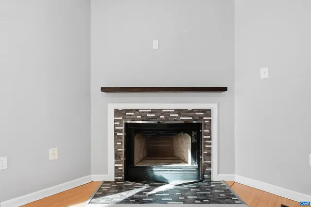 a living room with a fireplace