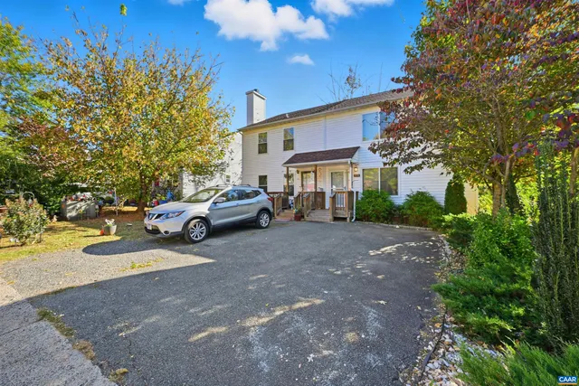 a view of a street with a building and a street sign