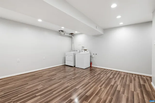 a view of a room with wooden floor