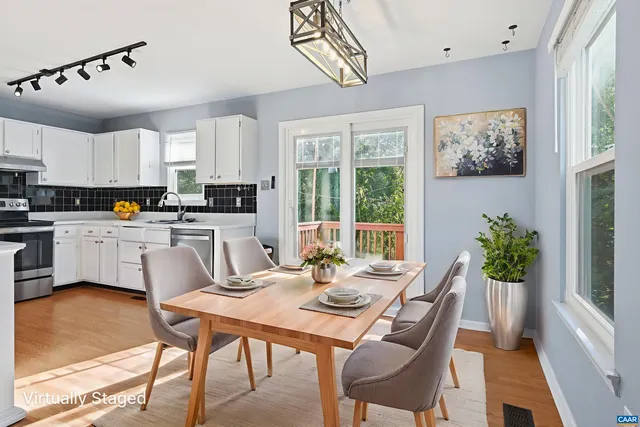 a dining room with furniture and window