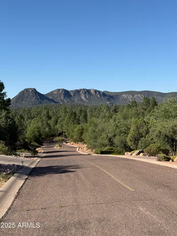 a view of road with an ocean view