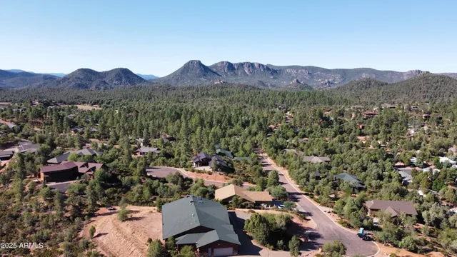 an aerial view of residential house and sandy dunes