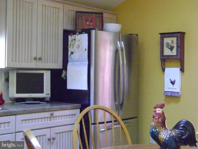 612 Old Fallston Road Fallston, MD 21047 - Photo 7 of 21 Kitchen showing the refrigerator and table.