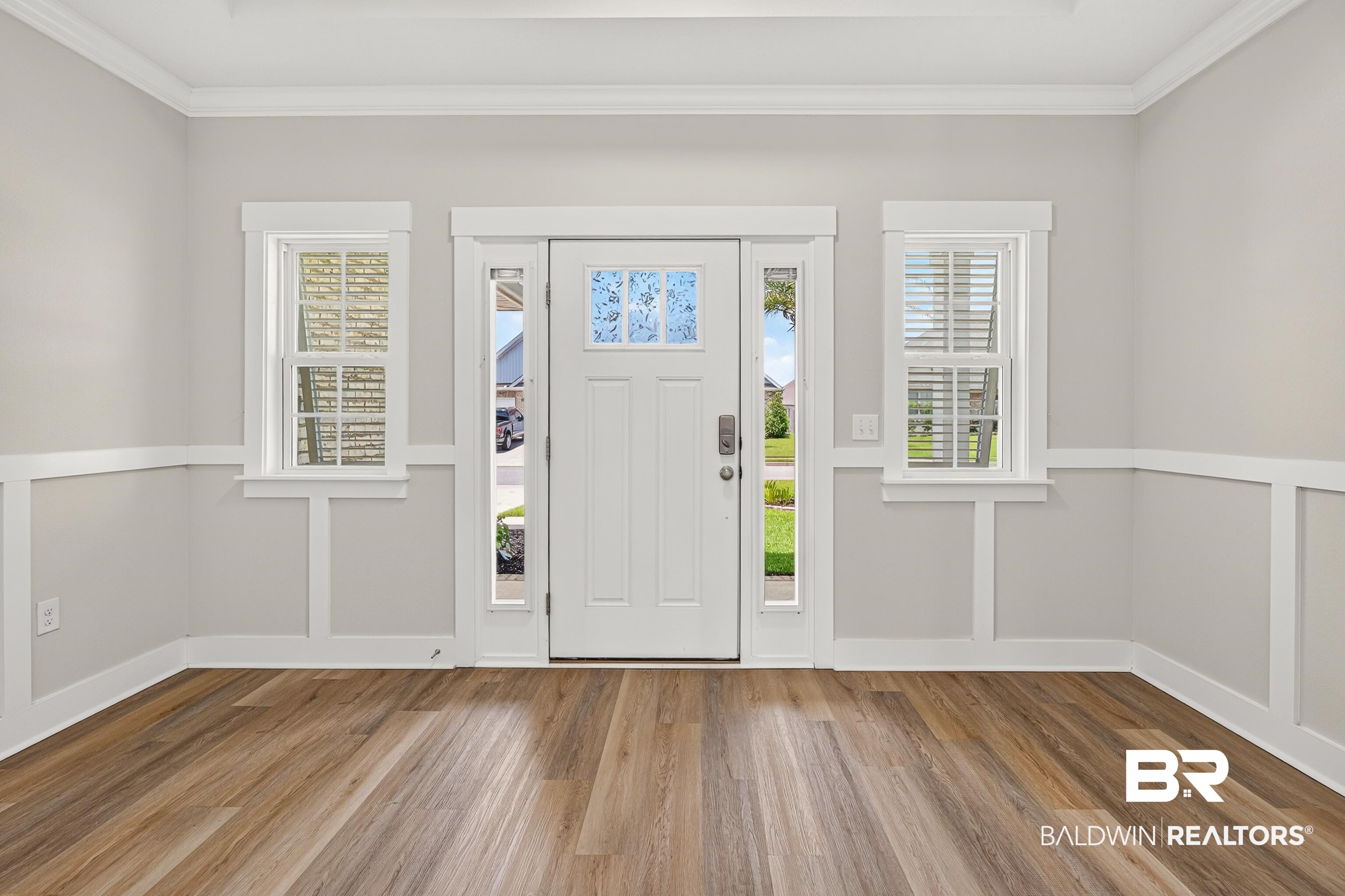 1724 Partridge Street Foley, AL 36535 - Photo 10 of 62 Entryway featuring a paneled door with decorative glass inserts, sidelights, and transom window