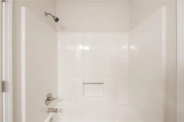 a close view of a bathtub in a bathroom