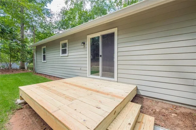 a backyard of a house with large trees