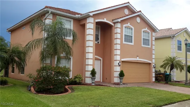 a front view of house with yard and green space