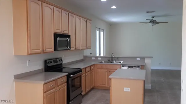 a utility room with sink dryer and washer