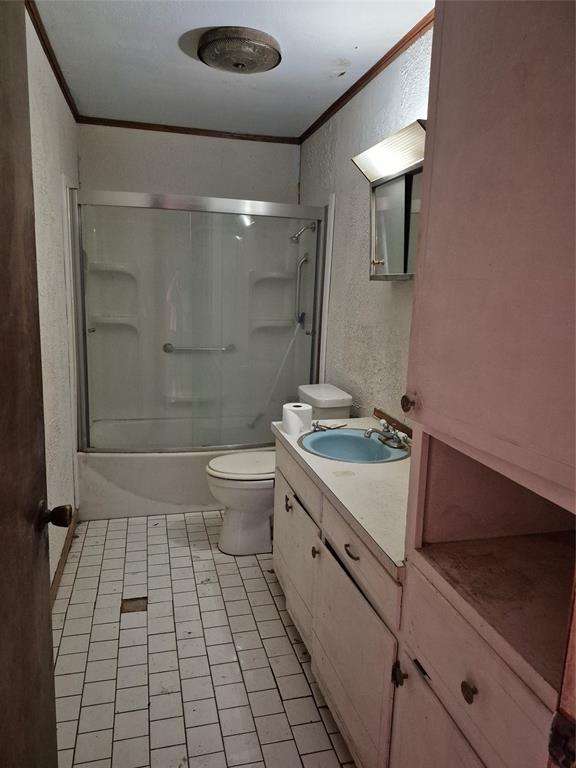 38 County Road 1180 Cooper, TX 75432 - Photo 13 of 25 a bathroom with a granite countertop sink a toilet and shower