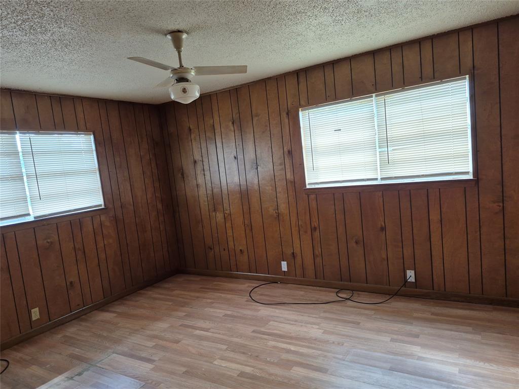 38 County Road 1180 Cooper, TX 75432 - Photo 17 of 25 an empty room with wooden floor and windows