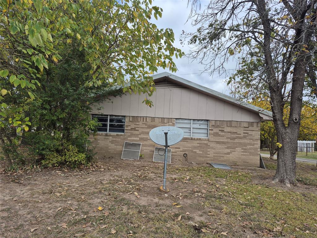 38 County Road 1180 Cooper, TX 75432 - Photo 24 of 25 a backyard of a house with table and chairs