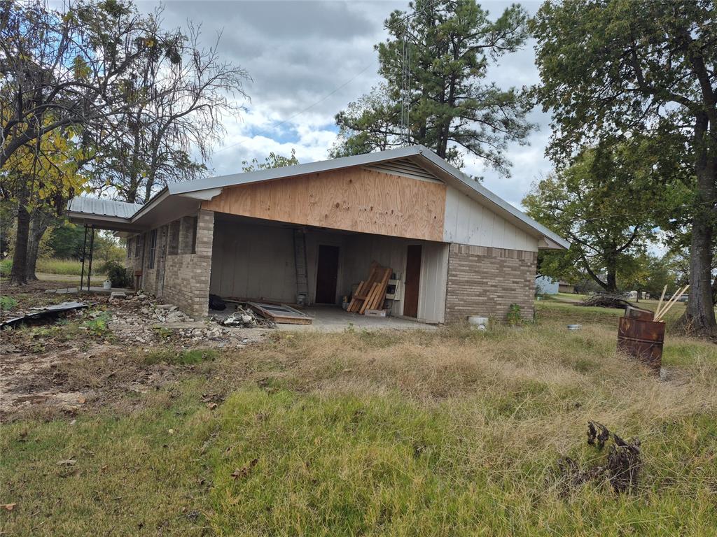 38 County Road 1180 Cooper, TX 75432 - Photo 25 of 25 a view of a house with a yard and large tree