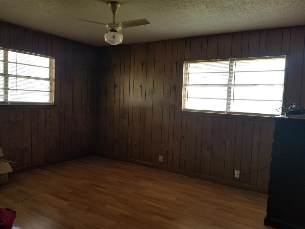 38 County Road 1180 Cooper, TX 75432 - Photo 6 of 25 an empty room with wooden floor windows and entrance