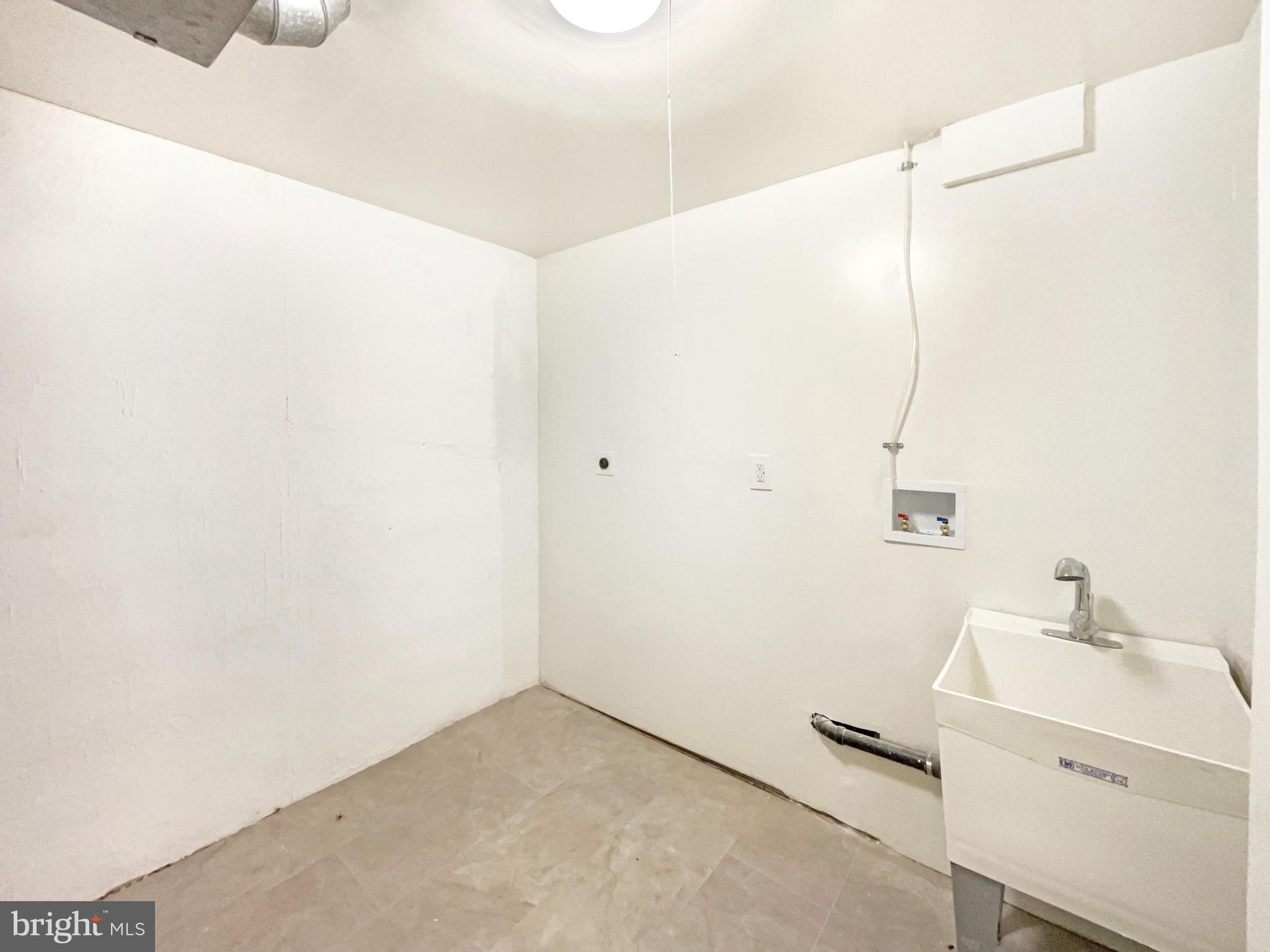 10103 Meredith Avenue Silver Spring, MD 20910 - Photo 14 of 23 a bathroom with a sink and a mirror