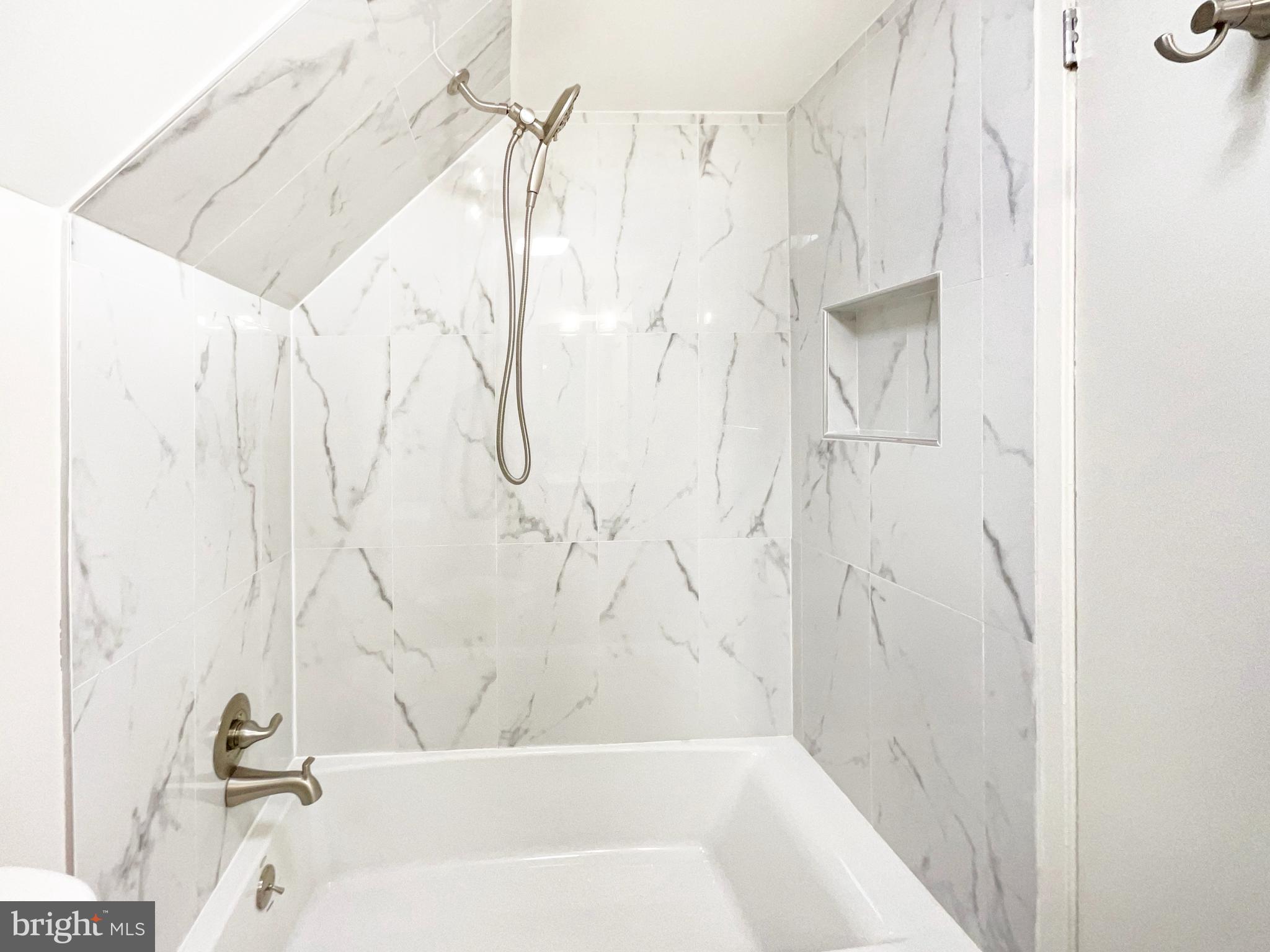 10103 Meredith Avenue Silver Spring, MD 20910 - Photo 20 of 23 a bathroom with a bathtub and shower