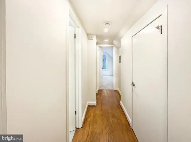 a view of a bathroom from a hallway
