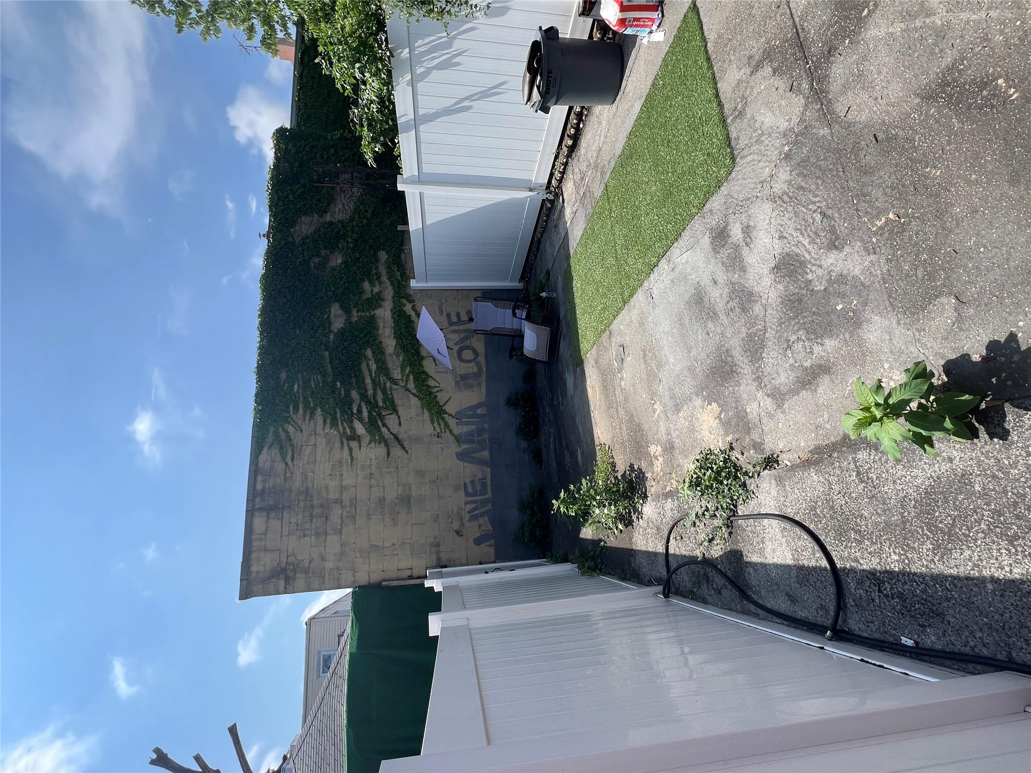 90-28 78th Street Queens, NY 11421 - Photo 11 of 14 View of yard with a patio