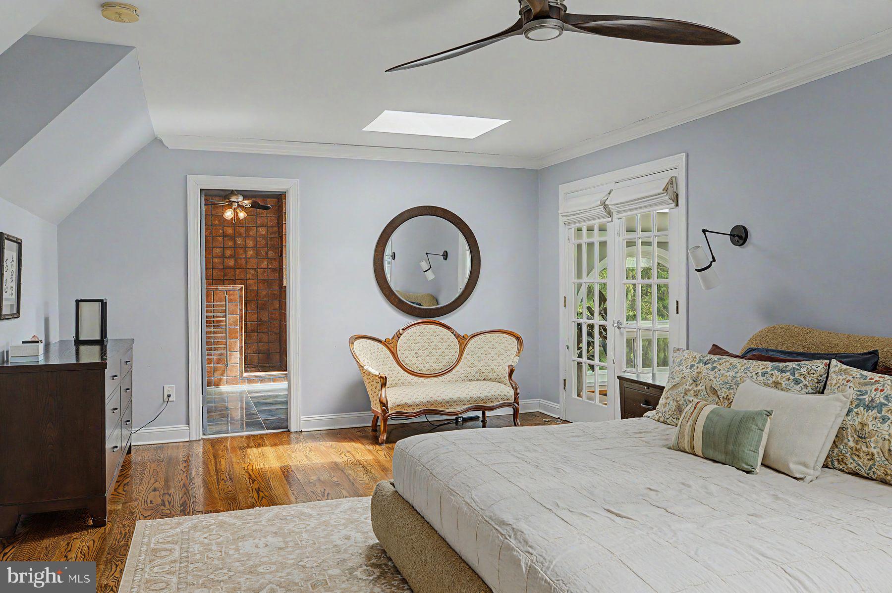 4009 Smoke Road Doylestown, PA 18902 - Photo 31 of 52 a bedroom with a bed a mirror and a large window