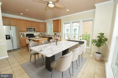11412 Grandview Avenue Silver Spring, MD 20902 - Photo 10 of 17 DECORATIVE DINING AREA NEXT TO WALL OF WINDOWS
