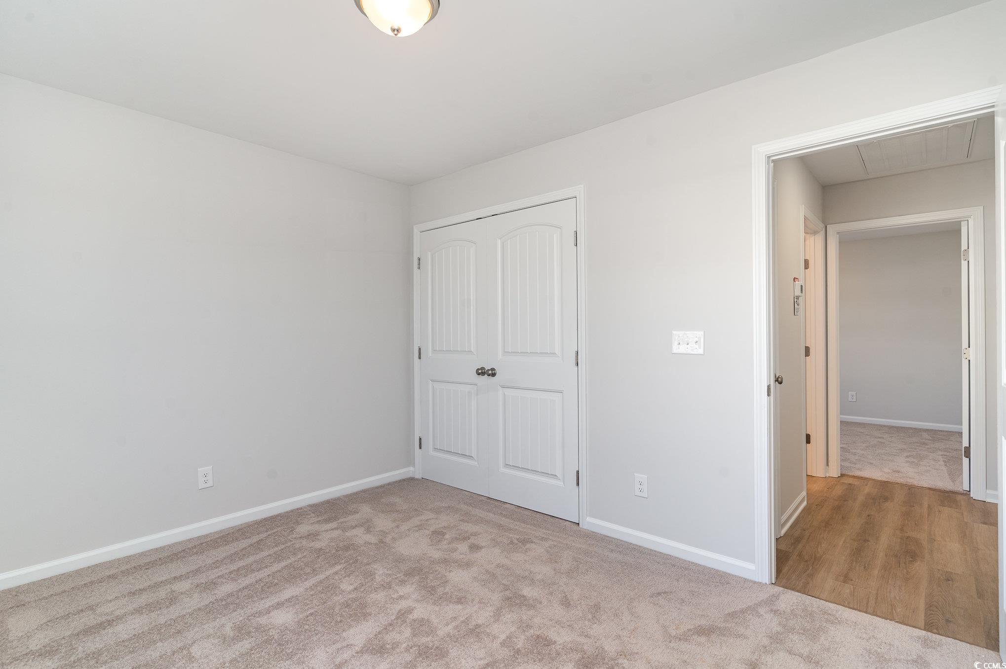 330 Barn Owl Way Conway, SC 29526 - Photo 17 of 23 Unfurnished bedroom featuring light colored carpet and a closet