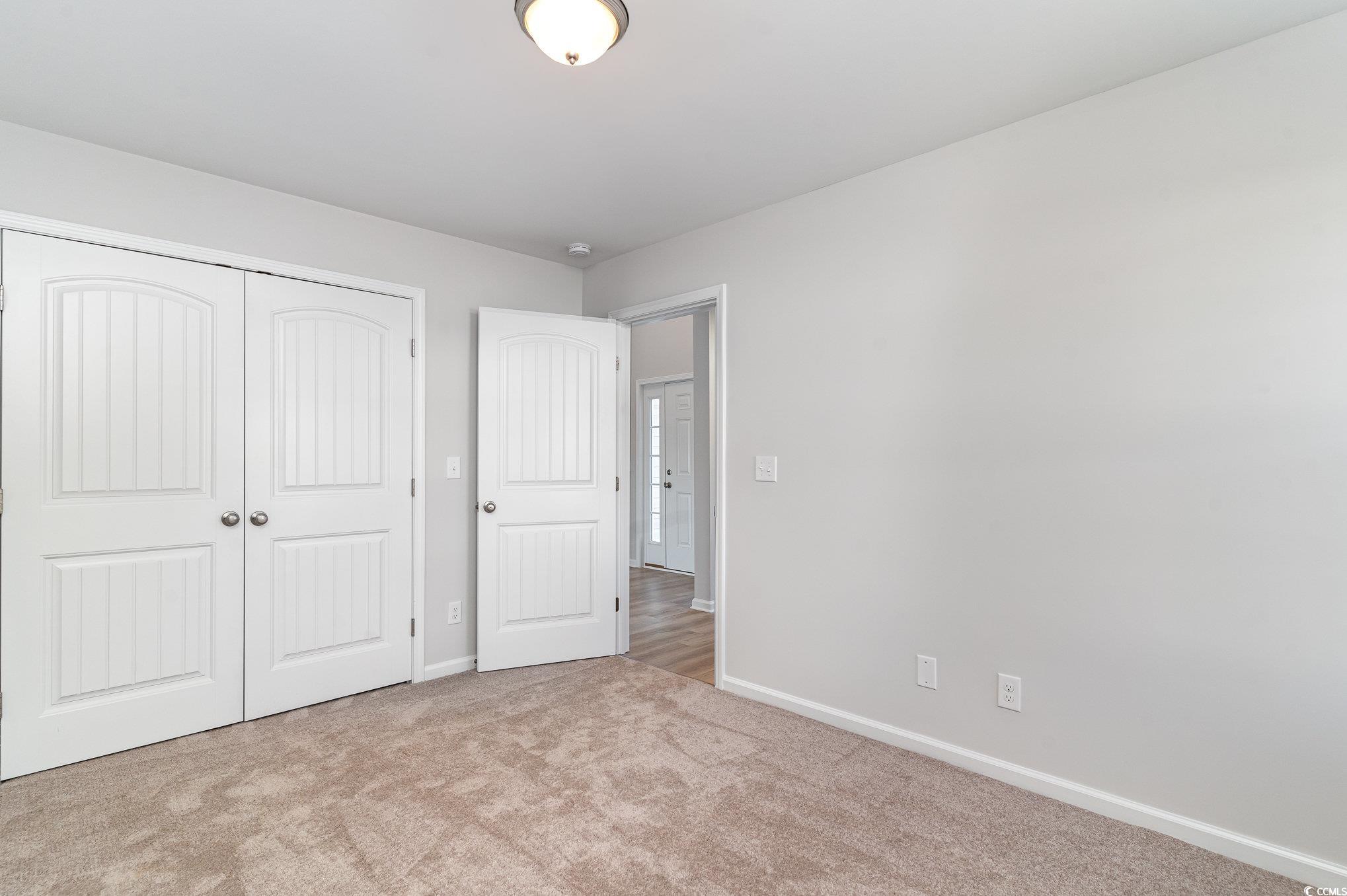 330 Barn Owl Way Conway, SC 29526 - Photo 20 of 23 Unfurnished bedroom with carpet floors and a closet