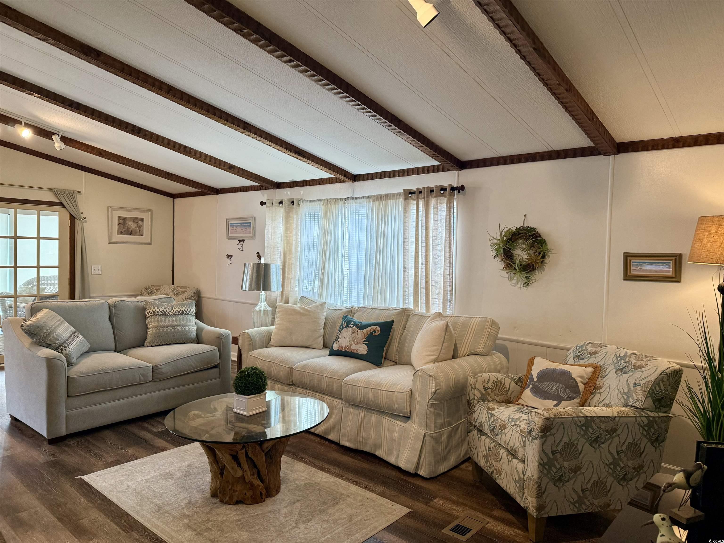 1801 E Lake Surfside Beach, SC 29575 - Photo 11 of 32 Living room with plenty of natural light and wood finished floors