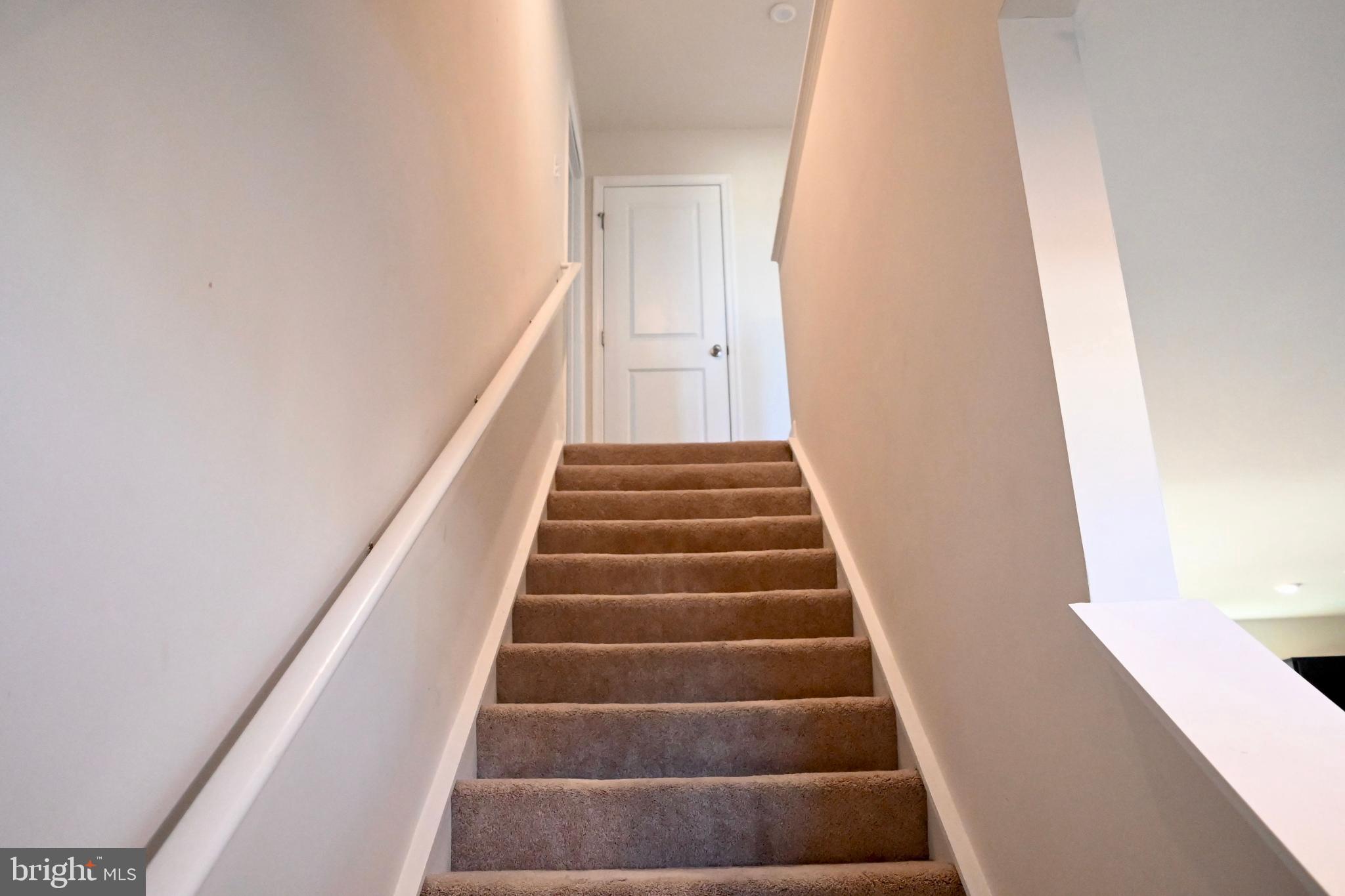 110 Mariners Way Cambridge, MD 21613 - Photo 9 of 22 Inviting ascent to a serene upper level.