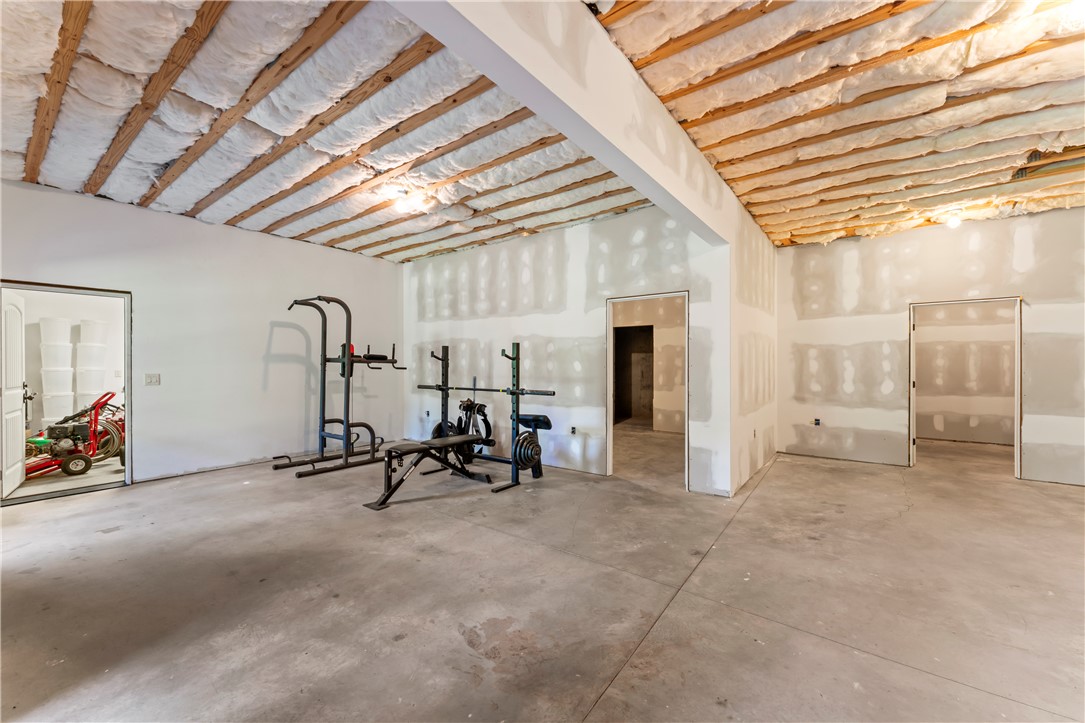 579 Terrapin Crossing Road Pickens, SC 29671 - Photo 42 of 50 A spacious, versatile room with high ceilings shows a glimpse into the basement garage