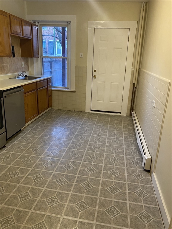 72 Florida Street, Unit 1 Boston, MA 02124 - Photo 3 of 9 a bathroom with a sink and a mirror