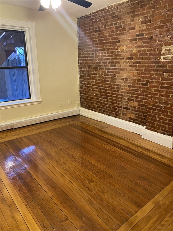 72 Florida Street, Unit 1 Boston, MA 02124 - Photo 6 of 9 a view of wooden floor