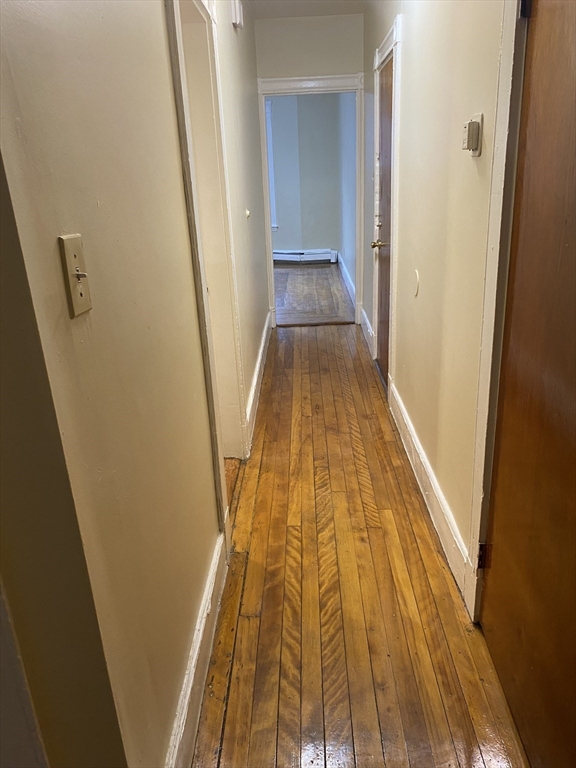 72 Florida Street, Unit 1 Boston, MA 02124 - Photo 7 of 9 a view of wooden floor