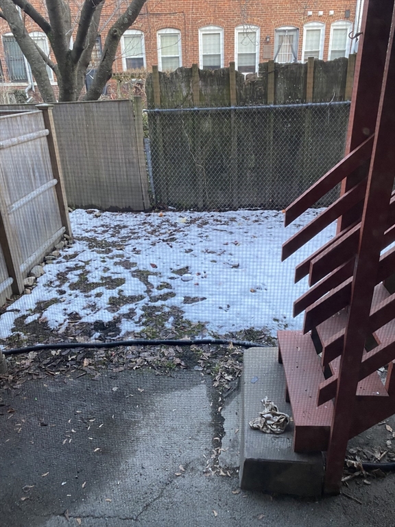 72 Florida Street, Unit 1 Boston, MA 02124 - Photo 9 of 9 a view of a terrace with a bench