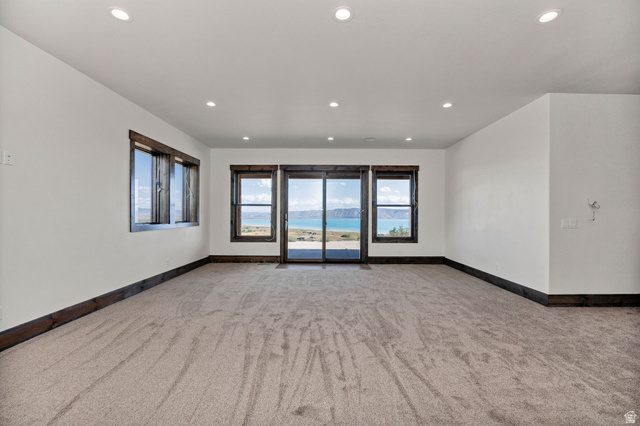 300 Knoll Loop, Unit 227 Fish Haven, ID 83287 - Photo 25 of 56 Empty room featuring light carpet and recessed lighting