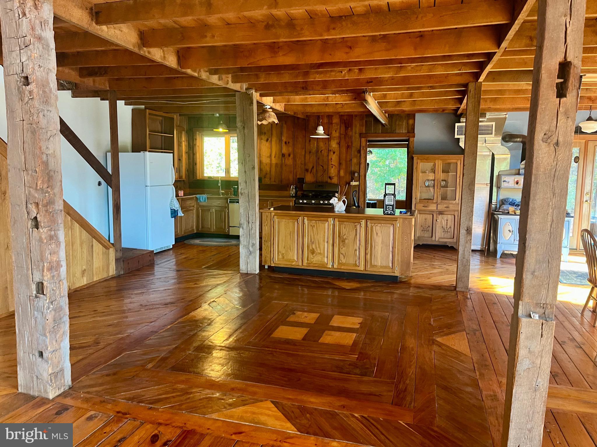 3041 Pine Grove Road Berkeley Springs, WV 25411 - Photo 15 of 99 a view of a porch with wooden floor and entrance