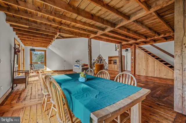 a view of a two chairs in the balcony
