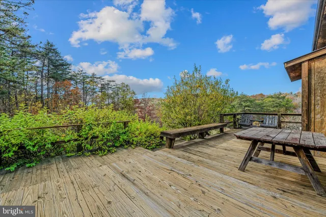 a view of a yard with table and chairs
