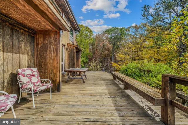 a view of a chairs and table on the deck
