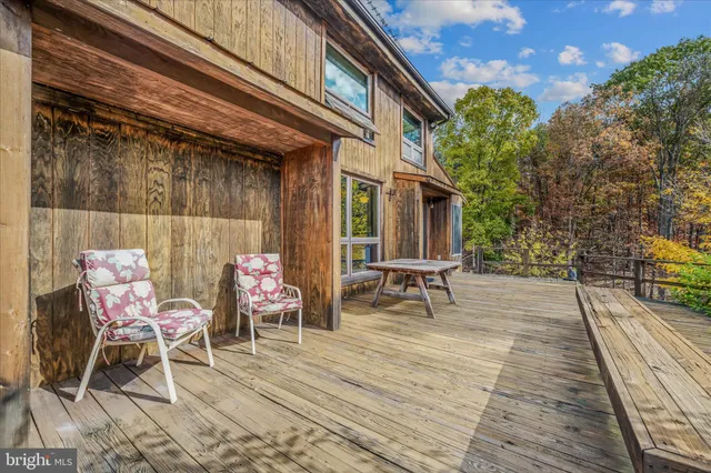 a view of balcony with wooden floor