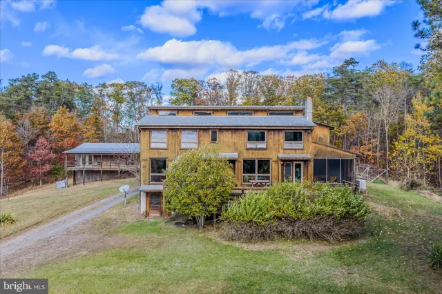 a view of a house with a yard porch and sitting area
