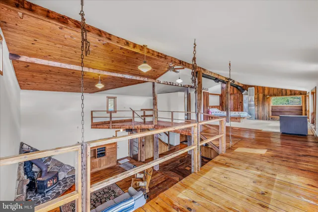 an empty room with a empty space and a ceiling fan