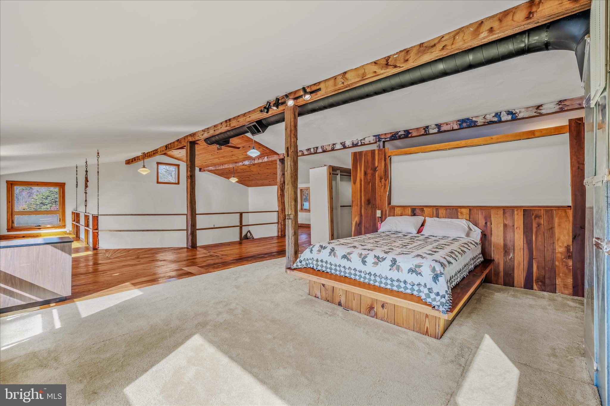 3041 Pine Grove Road Berkeley Springs, WV 25411 - Photo 37 of 99 a bedroom with a bed and a dresser next to a window