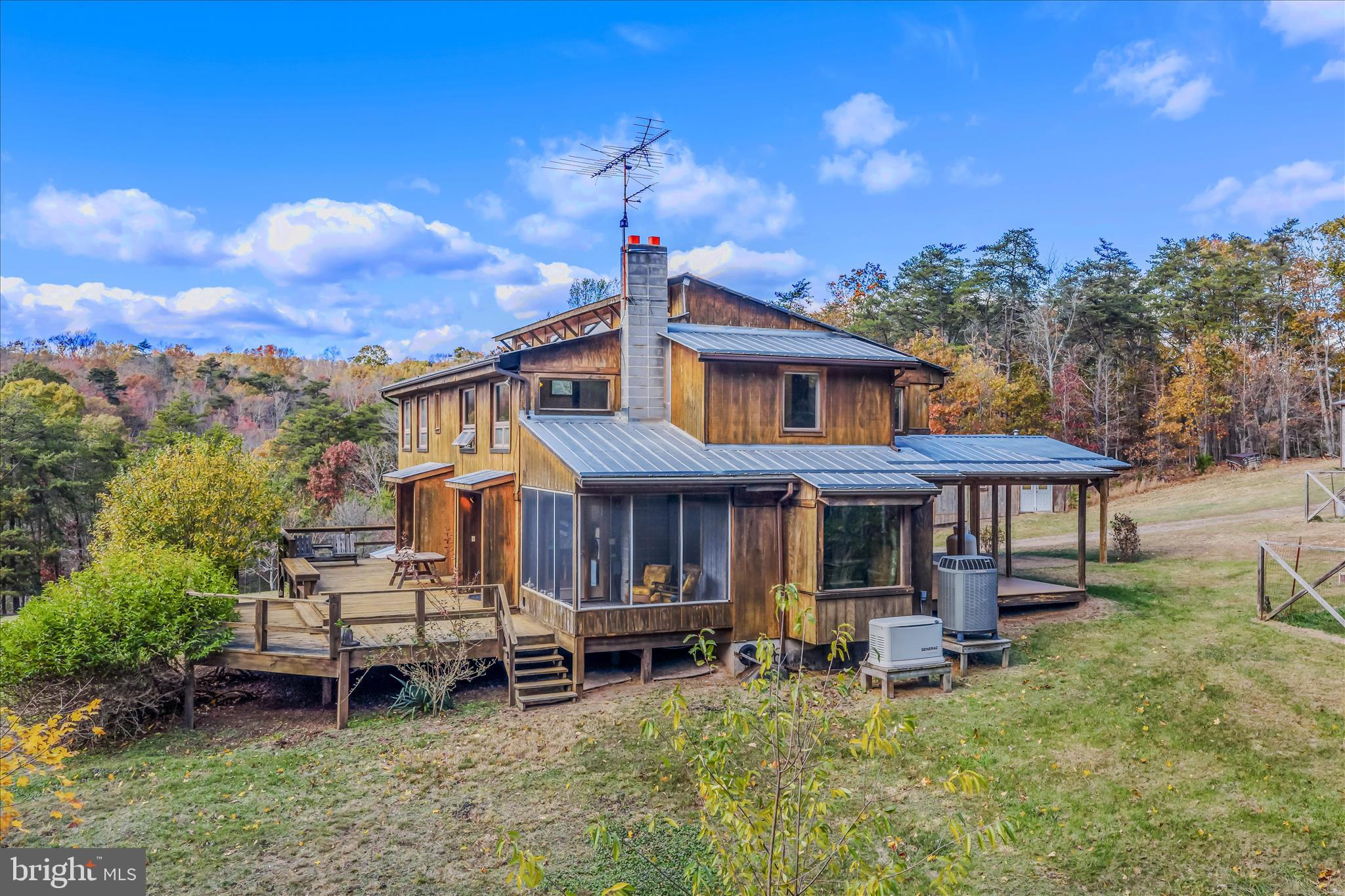 3041 Pine Grove Road Berkeley Springs, WV 25411 - Photo 5 of 99 a view of a house with a yard porch and sitting area