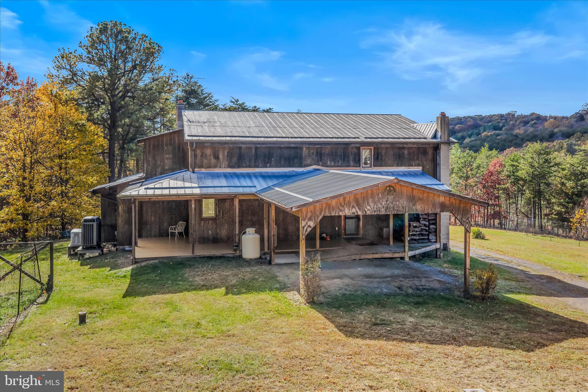 3041 Pine Grove Road Berkeley Springs, WV 25411 - Photo 6 of 99 a view of a house with swimming pool and porch