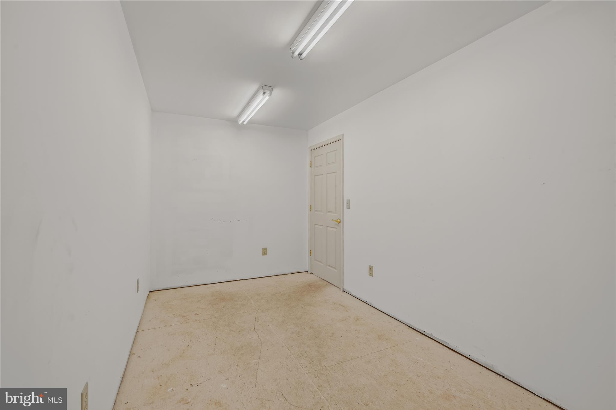 3041 Pine Grove Road Berkeley Springs, WV 25411 - Photo 61 of 99 an empty room with a empty space and a ceiling fan