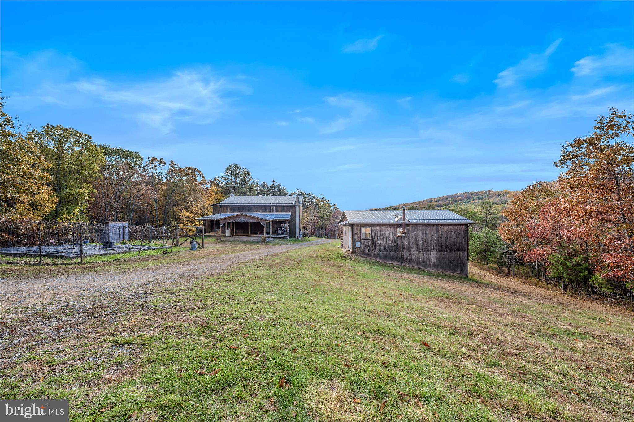 3041 Pine Grove Road Berkeley Springs, WV 25411 - Photo 68 of 99 a view of a house with a yard and sitting area