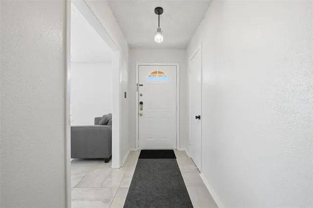 a view of a hallway with a white walls