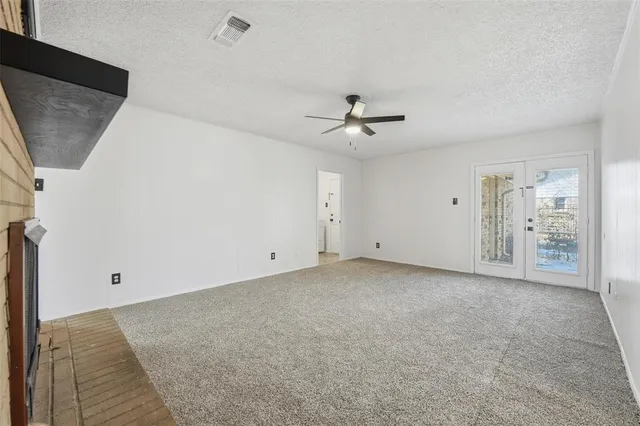 a view of an empty room with a bathroom